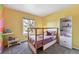 Bright, cheery bedroom with a cozy bed and a fun, playful decor at 270 S Locust St, Denver, CO 80224