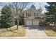 Charming two-story home with red shutters, a two-car garage and a manicured front yard at 270 S Locust St, Denver, CO 80224