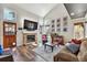 Cozy living room showcasing a brick fireplace, hardwood floors, and plenty of natural light at 270 S Locust St, Denver, CO 80224