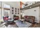 Elegant living room featuring stylish decor, plush seating, and ample natural light from the windows at 270 S Locust St, Denver, CO 80224
