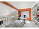 Loft office space with large window, custom shelving, and bright accent wall at 270 S Locust St, Denver, CO 80224