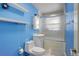 Bright blue bathroom featuring updated vanity and shower at 460 Lansing St, Aurora, CO 80010