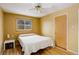 Bright bedroom with wood floors and ceiling fan at 460 Lansing St, Aurora, CO 80010