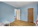 Bedroom featuring light blue walls and wood flooring at 460 Lansing St, Aurora, CO 80010