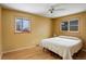 Cozy bedroom with wood floors and bright yellow walls at 460 Lansing St, Aurora, CO 80010