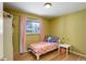 Cozy bedroom with hardwood floors, neutral walls and a window for natural light at 460 Lansing St, Aurora, CO 80010