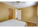 Sunny bedroom with white ceiling fan and two closets at 460 Lansing St, Aurora, CO 80010