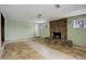 Spacious living room features a stone fireplace and tile flooring at 460 Lansing St, Aurora, CO 80010