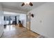 Open-concept living room with tile flooring, a ceiling fan, and an adjoining seating area at 460 Lansing St, Aurora, CO 80010