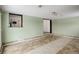 Open living room with bright green walls and tile flooring at 460 Lansing St, Aurora, CO 80010