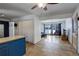 View of the kitchen with a large opening to an adjacent living room at 460 Lansing St, Aurora, CO 80010