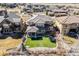 Aerial view of a beautiful home showcasing manicured lawn and neighborhood at 493 Pine Flower Ct, Highlands Ranch, CO 80126