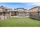 Spacious backyard with artificial turf, patio, and trampoline at 493 Pine Flower Ct, Highlands Ranch, CO 80126