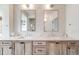 Elegant bathroom with double sinks, vanity cabinets, and modern fixtures at 493 Pine Flower Ct, Highlands Ranch, CO 80126