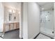 Bright bathroom boasts double sinks, a modern shower, and stylish finishes at 493 Pine Flower Ct, Highlands Ranch, CO 80126