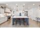 Modern kitchen with white cabinetry, a large island, and stainless steel appliances at 493 Pine Flower Ct, Highlands Ranch, CO 80126
