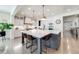 Bright, open kitchen featuring a large island with seating and modern pendant lighting at 493 Pine Flower Ct, Highlands Ranch, CO 80126