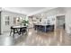 Open-concept kitchen and dining area featuring hardwood floors and lots of natural light at 493 Pine Flower Ct, Highlands Ranch, CO 80126