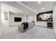 Spacious living room with recessed lighting, plush carpeting, and a built-in entertainment center at 493 Pine Flower Ct, Highlands Ranch, CO 80126