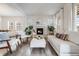 Cozy living room with fireplace, stylish furniture and lots of natural light at 493 Pine Flower Ct, Highlands Ranch, CO 80126