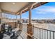 Covered patio offering neighborhood views with outdoor seating for relaxing and enjoying the scenery at 493 Pine Flower Ct, Highlands Ranch, CO 80126