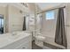 Bright bathroom with a bathtub, shower, white tiled walls, and modern vanity at 14333 E 1St Dr # 307, Aurora, CO 80011