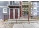 Close-up of building entrance with brick detail and handicap ramp accessibility to the condo units at 14333 E 1St Dr # 307, Aurora, CO 80011