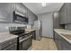 Well-equipped kitchen featuring stainless steel appliances and granite countertops at 14333 E 1St Dr # 307, Aurora, CO 80011