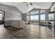 Bright living room with vaulted ceilings, large windows, and access to a private balcony overlooking the mountains at 14333 E 1St Dr # 307, Aurora, CO 80011