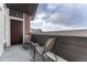 Outdoor patio with chairs and a table, creating a cozy spot for relaxation with an inviting view at 14333 E 1St Dr # 307, Aurora, CO 80011
