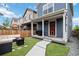 Great backyard with artificial turf and a covered porch at 12740 Tamarac St, Thornton, CO 80602