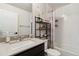 Bright bathroom featuring a shower and tub combination, plus a modern vanity sink at 12740 Tamarac St, Thornton, CO 80602
