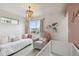 Charming Bedroom with daybed, chair, and soft color palette at 12740 Tamarac St, Thornton, CO 80602