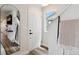 Clean entryway featuring modern mirror and bright, neutral decor at 12740 Tamarac St, Thornton, CO 80602