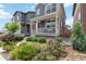 Well-maintained home with landscaped front yard and inviting front porch at 12740 Tamarac St, Thornton, CO 80602