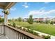 Charming community view with a grassy field, sidewalks, and diverse home exteriors at 12740 Tamarac St, Thornton, CO 80602