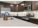 Spacious kitchen featuring stainless steel appliances and modern finishes at 12740 Tamarac St, Thornton, CO 80602