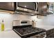 Stainless steel gas range and oven with subway tile backsplash at 12740 Tamarac St, Thornton, CO 80602