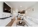 Spacious living room with modern entertainment setup and open floor plan at 12740 Tamarac St, Thornton, CO 80602