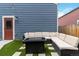 Inviting patio with a fire pit and comfortable seating, perfect for outdoor entertaining at 12740 Tamarac St, Thornton, CO 80602