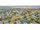 Beautiful aerial view of a residential community boasting mature, colorful trees lining the streets in the fall at 2290 S Braun Way, Lakewood, CO 80228