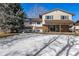 The back exterior features a covered patio ideal for enjoying outdoor living and entertainment at 2290 S Braun Way, Lakewood, CO 80228