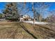 Expansive backyard featuring mature trees creating a beautiful outdoor space at 2290 S Braun Way, Lakewood, CO 80228