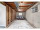 Unfinished basement offering exposed ceiling, a new window and ready for customization to create your dream space at 2290 S Braun Way, Lakewood, CO 80228