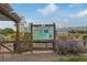 Ute Trail community garden sign with a green board and landscaping within a park at 2290 S Braun Way, Lakewood, CO 80228