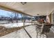 Inviting covered patio featuring patio furniture for outdoor relaxation with a view of the backyard at 2290 S Braun Way, Lakewood, CO 80228