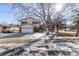 Charming two-story home with a spacious front yard and a lovely mature tree at 2290 S Braun Way, Lakewood, CO 80228