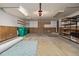 Spacious two-car garage with shelving, ample storage, and a clean, organized layout with plenty of room at 2290 S Braun Way, Lakewood, CO 80228