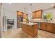 Well-designed kitchen with a large island, stainless steel appliances, and an adjacent living area at 2290 S Braun Way, Lakewood, CO 80228