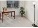 Bright home office featuring a desk, chair, houseplant and a large window bringing in natural light at 2290 S Braun Way, Lakewood, CO 80228